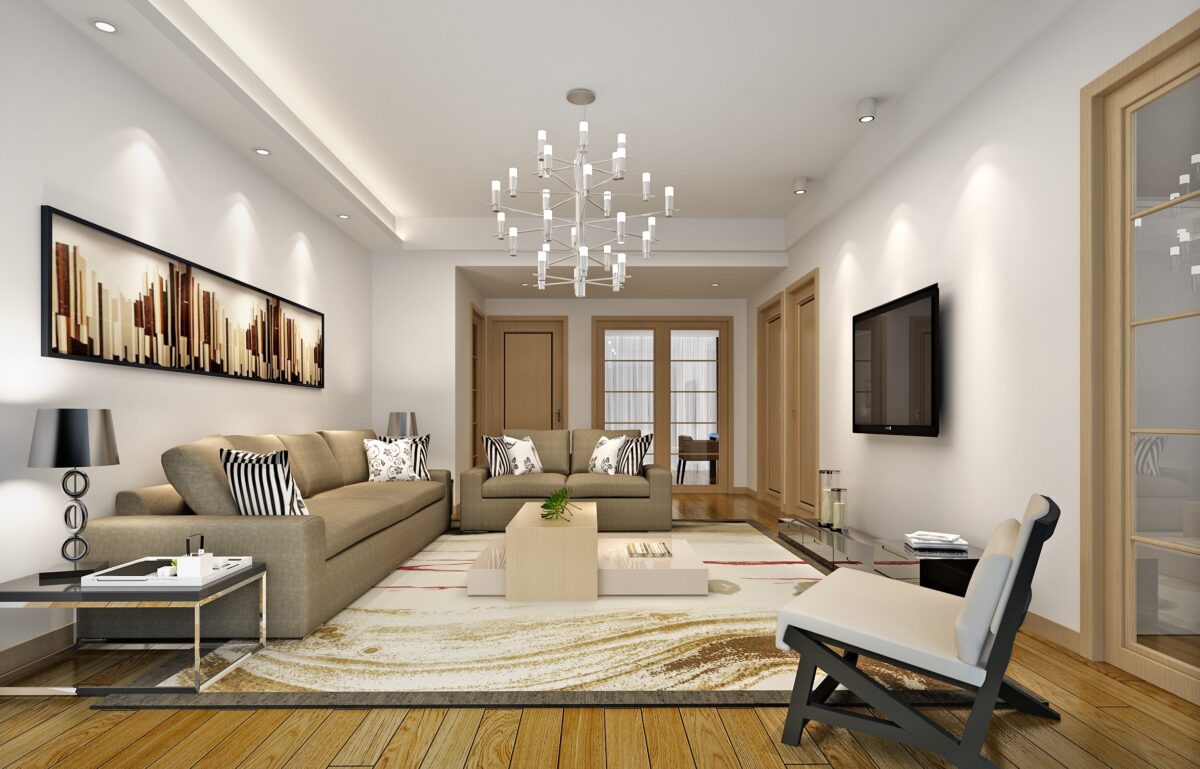 "Modern beige living room interior with a stylish sofa set, wooden flooring, chic wall art, and an elegant chandelier."
