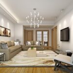 "Modern beige living room interior with a stylish sofa set, wooden flooring, chic wall art, and an elegant chandelier."