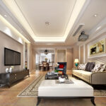 Classic living room with beige walls, tufted ottoman, blue accent chair, and elegant lighting