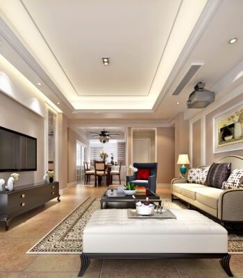 Classic living room with beige walls, tufted ottoman, blue accent chair, and elegant lighting