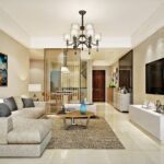 Neutral-toned living room interior with an L-shaped sofa, beige walls, elegant chandelier, and modern decor elements.