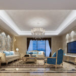 Classic European-style luxury living room with plush gold and blue furniture, crystal chandelier, and floral wall accents.