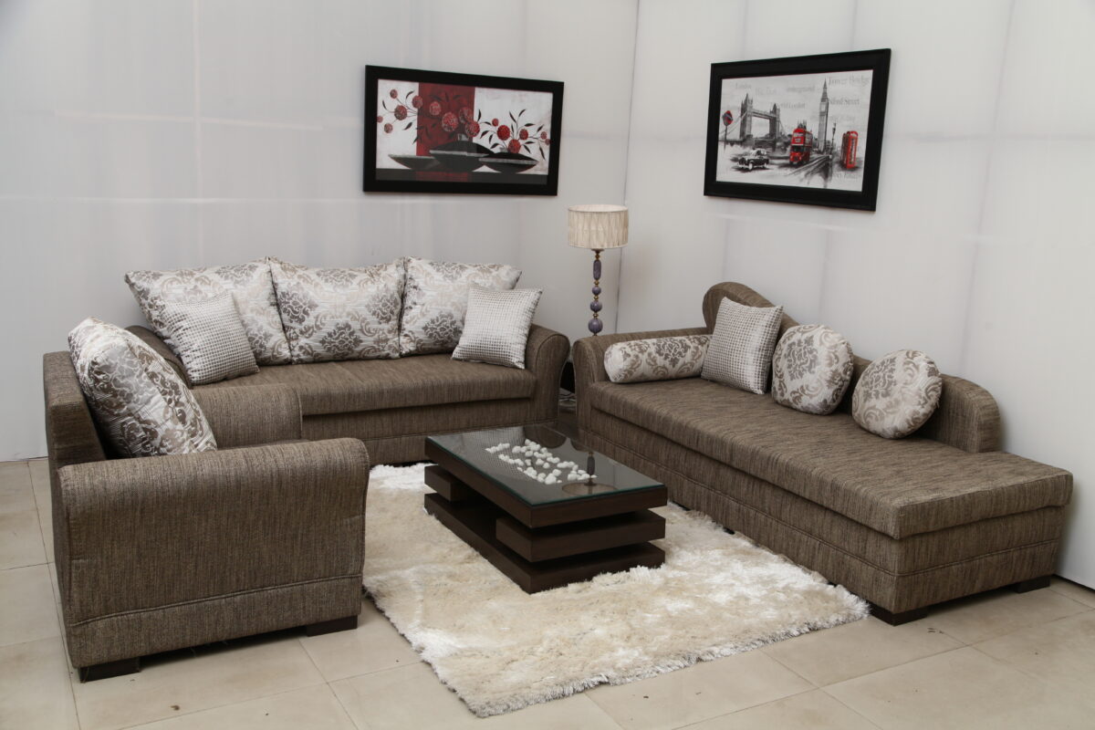 Modern luxury sofa set with premium fabric and elegant cushions, featuring a spacious seating arrangement and glass coffee table.
