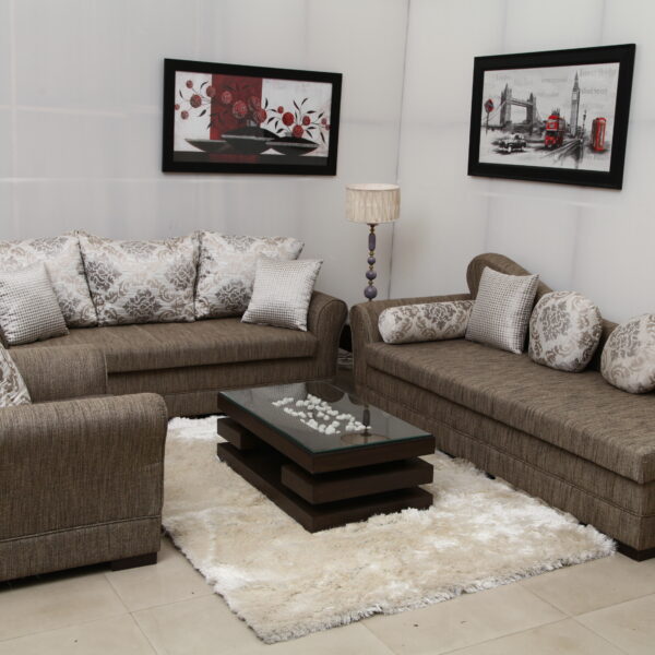 Modern luxury sofa set with premium fabric and elegant cushions, featuring a spacious seating arrangement and glass coffee table.