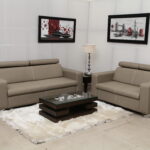 Modern beige leather sofa set with comfortable headrests, ideal for contemporary living rooms.