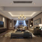Elegant living room featuring warm tones, wood-paneled walls, plush neutral-toned furniture, and a modern chandelier