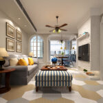Living and dining room with beige walls, hexagonal flooring, a gray sofa with yellow cushions, and wooden furniture.