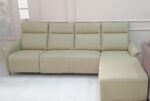 L-shape recliner sofa with premium fabric upholstery in a modern living room setting.