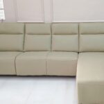 L-shape recliner sofa with premium fabric upholstery in a modern living room setting.