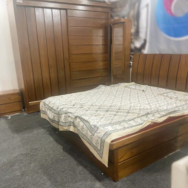 Classic wooden bedroom set with a slatted headboard, sliding wardrobe with a mirror, and matching nightstands