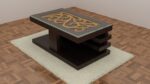 Wooden center table with artistic carved design under a tempered glass top, featuring a tiered structure on a plush rug.