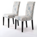 Elegant floral upholstered dining chairs with wooden legs, perfect for any dining room.