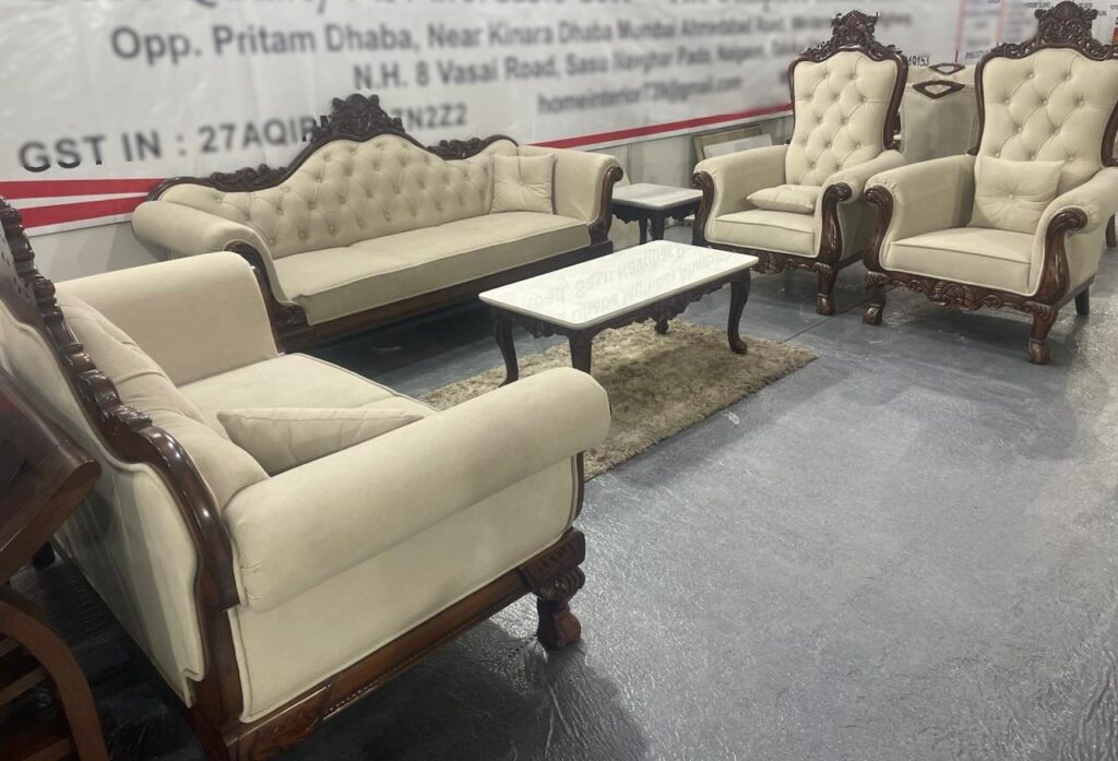 Luxurious royal sofa set featuring a 3+2+1+1 seating arrangement, plush beige upholstery, intricate woodwork, and a glass-top center table