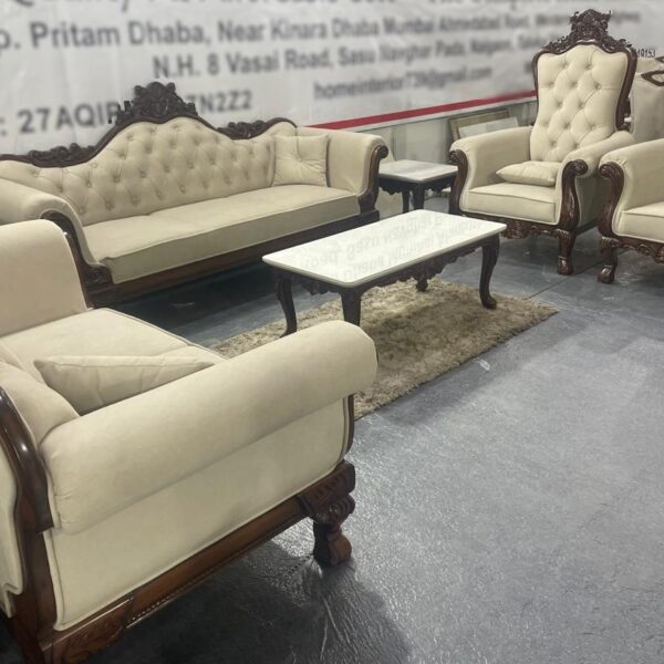 Luxurious royal sofa set featuring a 3+2+1+1 seating arrangement, plush beige upholstery, intricate woodwork, and a glass-top center table