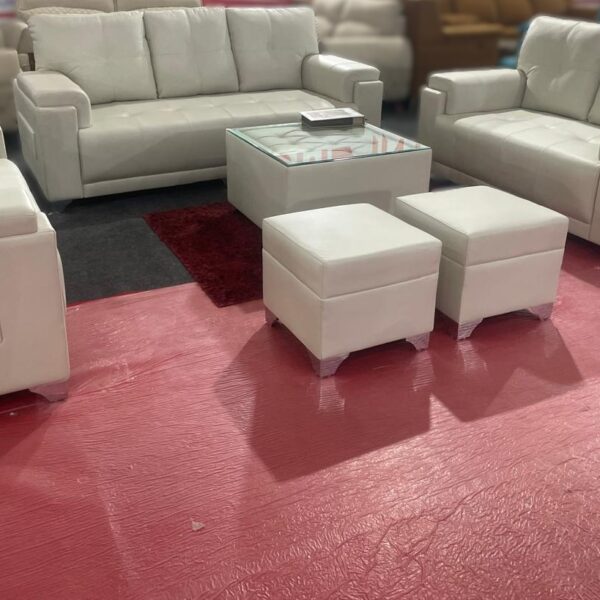 Modern 3+2 sofa set with white leatherette upholstery and matching ottomans, ideal for contemporary living rooms.