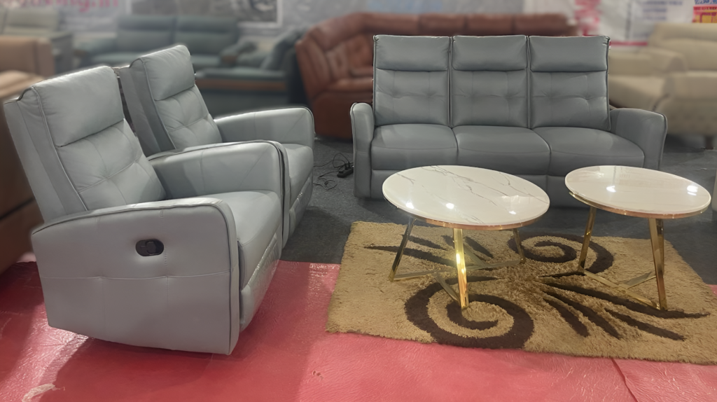 Rado Recliner 3+1+1 sofa set in gray leatherette, paired with luxurious marble-top coffee tables
