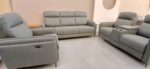 Modern recliner sofa set with plush upholstery, cup holders, and ergonomic design for a stylish and comfortable living room setup.