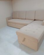L-shape sofa cum bed with storage, plush upholstery, and modern design for compact living spaces.
