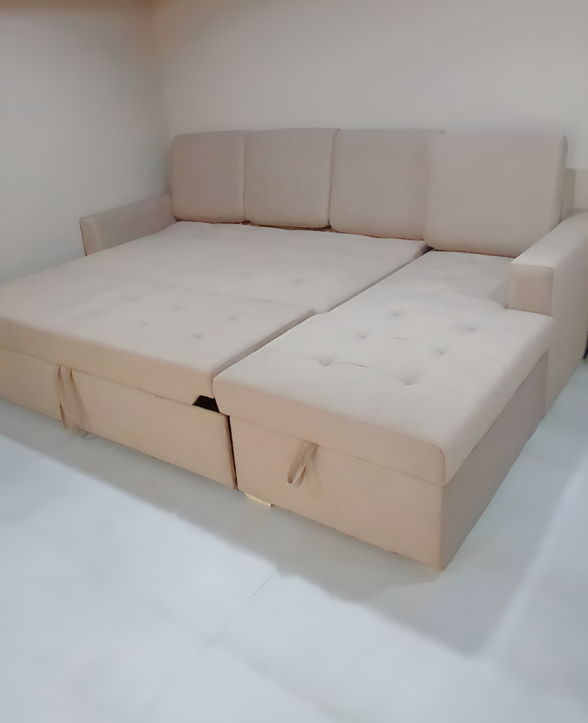 L-shape sofa cum bed with storage, plush upholstery, and modern design for compact living spaces