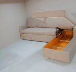 L-shape sofa cum bed with storage, plush upholstery, and modern design for compact living spaces